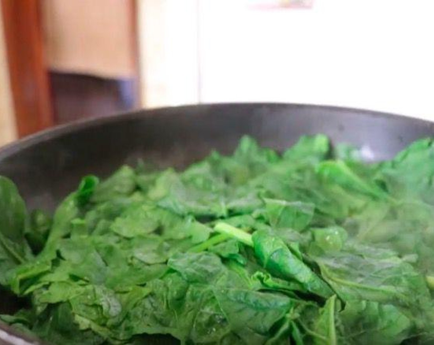 step 3 Add Water (2 Tbsp) into the same pan, then add Fresh Spinach (4 cups). Place a lid on top and steam for 2 minutes.
