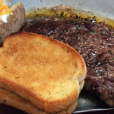 Sizzling Steak with Homemade Herb Butter Recipe | SideChef