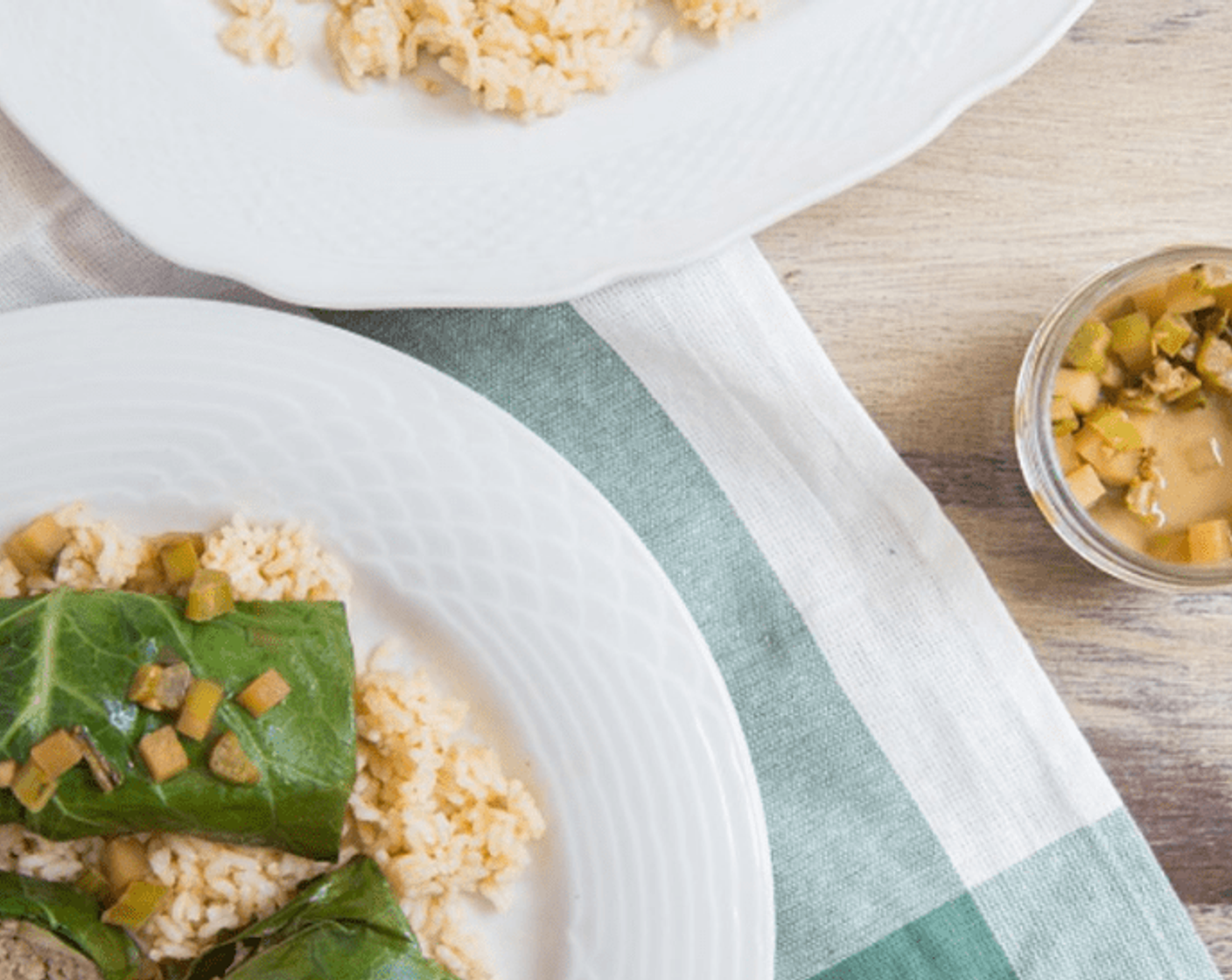 step 12 Divide rice between 2 plates. Place 2 stuffed collards on each plate, and top with collard stem and apple mixture. Enjoy!