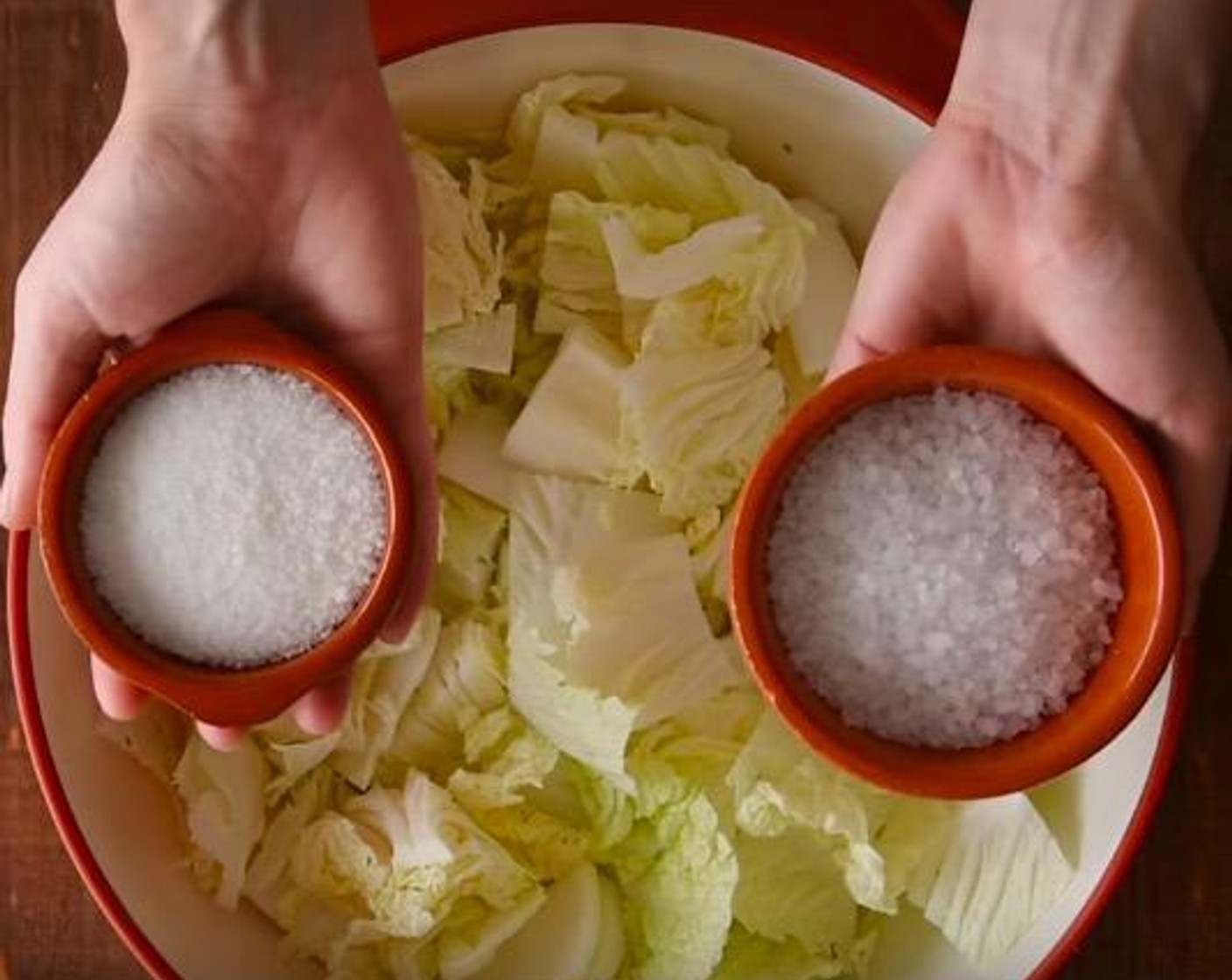 step 1 In a large bowl, combine Napa Cabbage (1) with Granulated Sugar (2 Tbsp) and Coarse Sea Salt (2 Tbsp). Toss until combined.