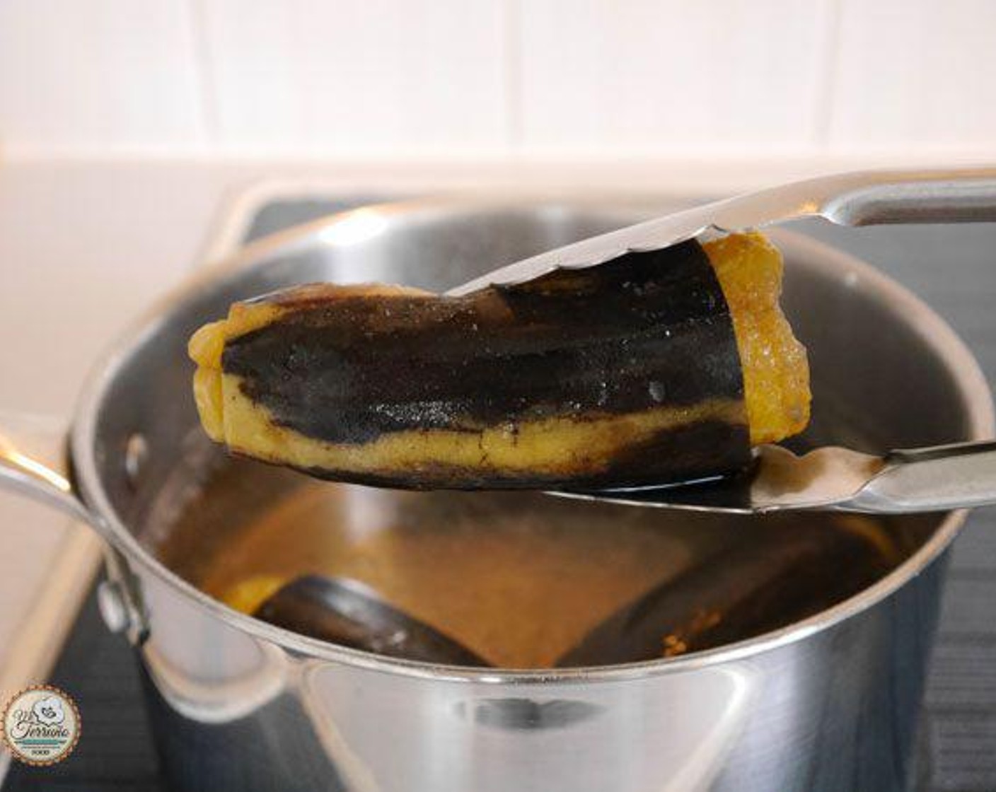 step 3 Remove the plantains from the water and leave to cool down without removing the skins.