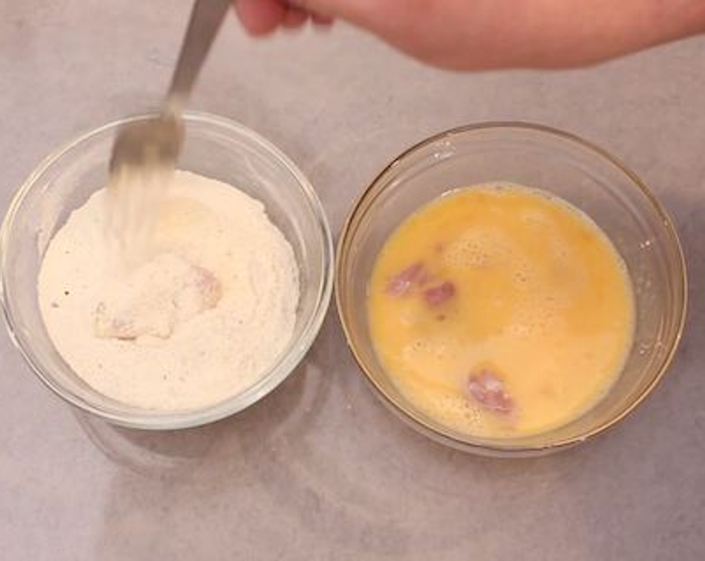 step 2 Dunk the Boneless, Skinless Chicken Thigh (1 lb) into the beaten eggs, then place into the seasoned protein powder. Get everything coated really well, placing finished pieces on a plate. Try to work quickly on this step - the longer you leave the chicken the more the powder will absorb into it. It really works best if you coat and fry as you go otherwise it can get patchy.