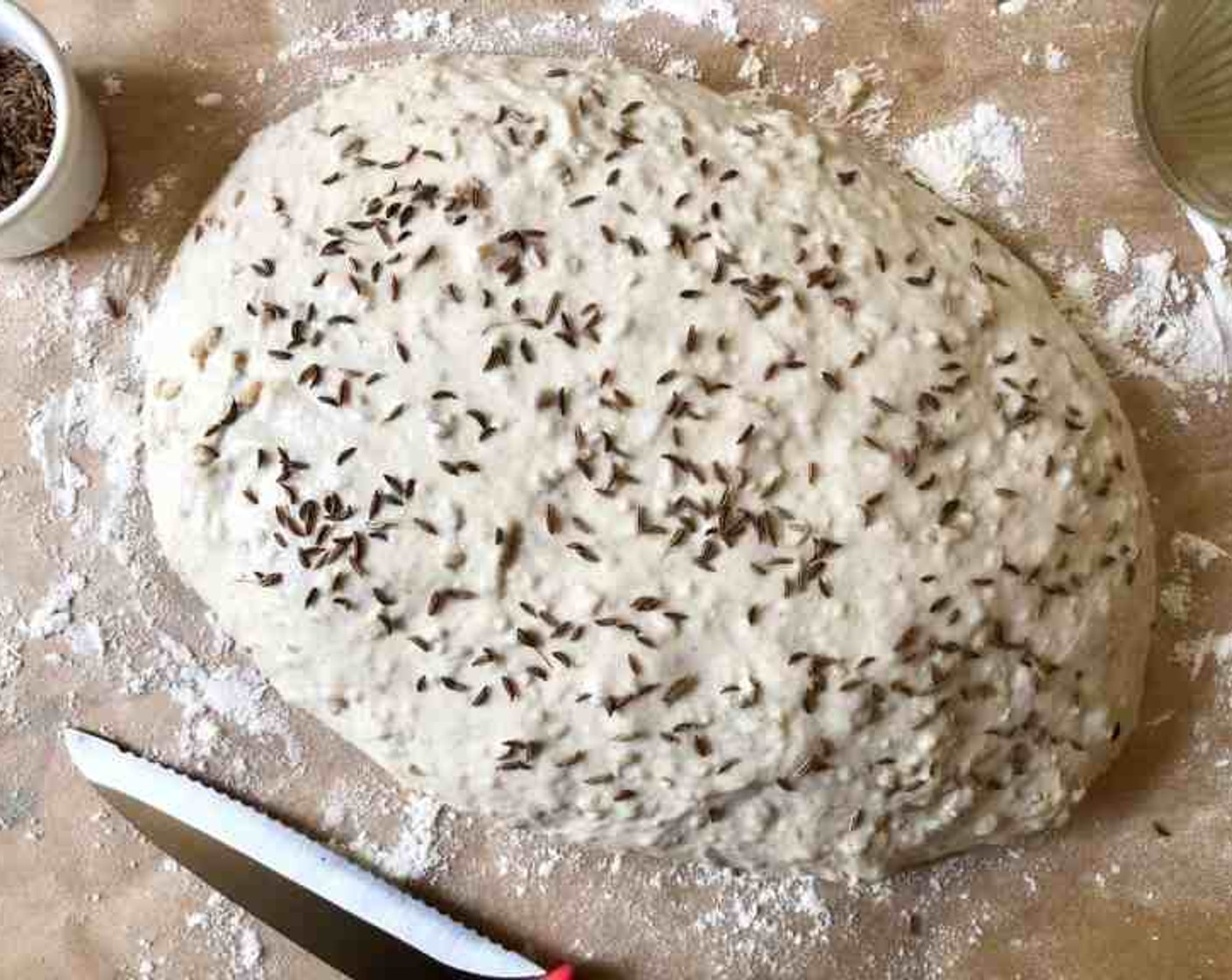 step 13 Using a pastry or basting brush, paint the top crust with water and then sprinkle with the caraway seeds.
