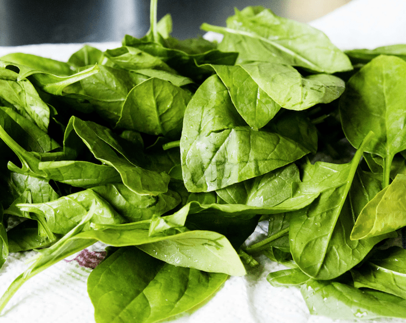 step 10 Meanwhile, mix spinach with remaining tablespoon of lemon juice and 1 tablespoon of olive oil; season with salt and pepper.