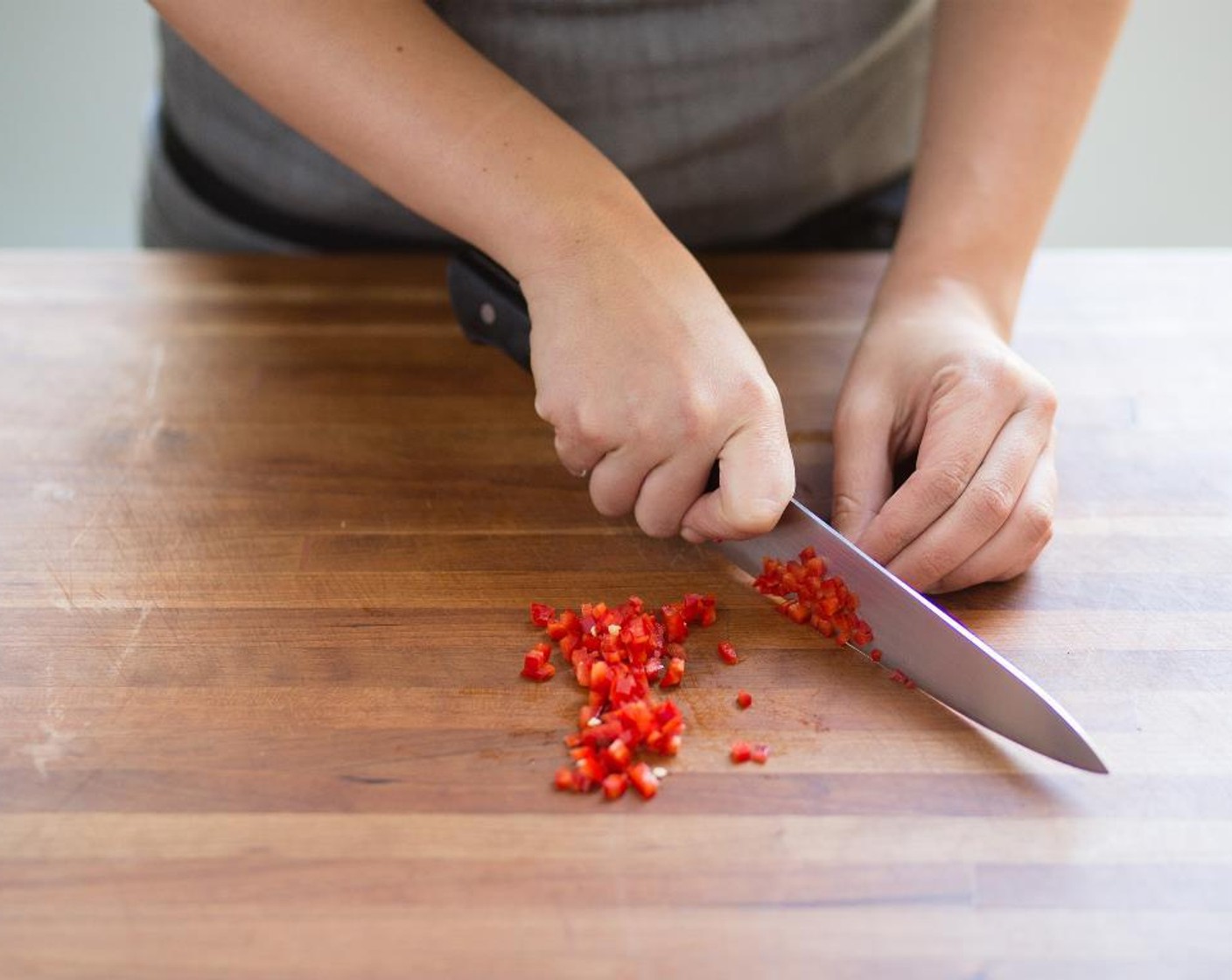 step 5 Remove the stem from the Red Fresno Chili Pepper (1) and discard stem. Finely chop the chili; set aside.