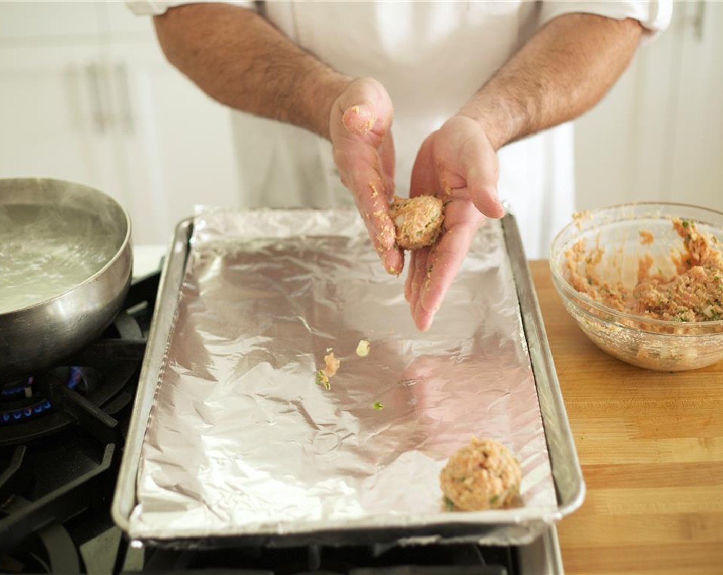 step 10 Form ten, quarter cup sized meatballs, and place on the foil lined baking sheet.