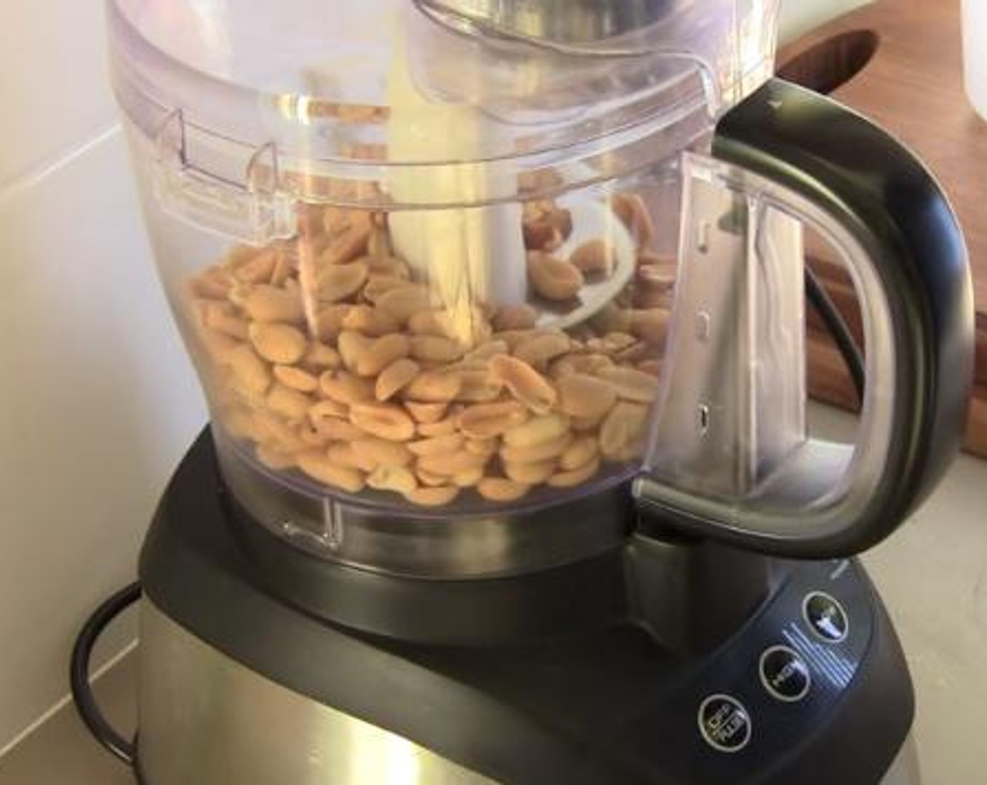 step 1 Add the Unsalted Peanuts (2 cups), into a food processor and pulse until a ground paste is formed. Add the Caster Sugar (1 tsp), Salt (1 pinch), and Vegetable Oil (1 Tbsp) and mix everything with the lid on.