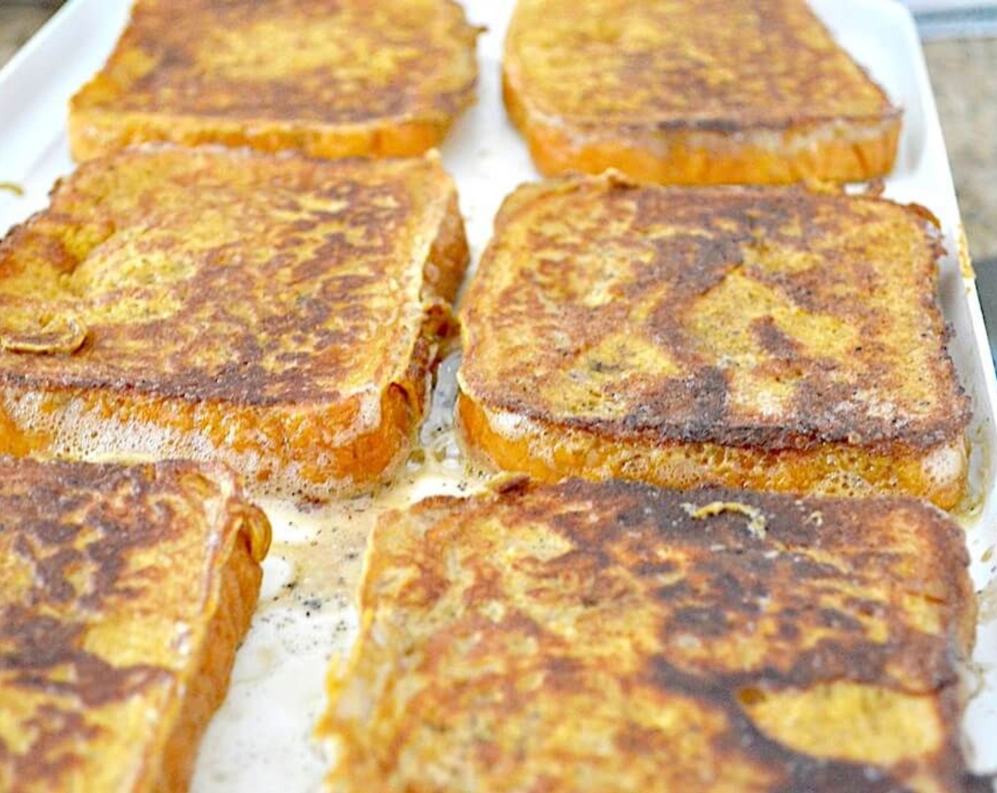 step 3 Dip each slice of Brioche (6 slices) in the custard for 5 seconds on each side, then place them immediately on the griddle. Cook them for about 2-3 minutes on each side, until they are golden brown.