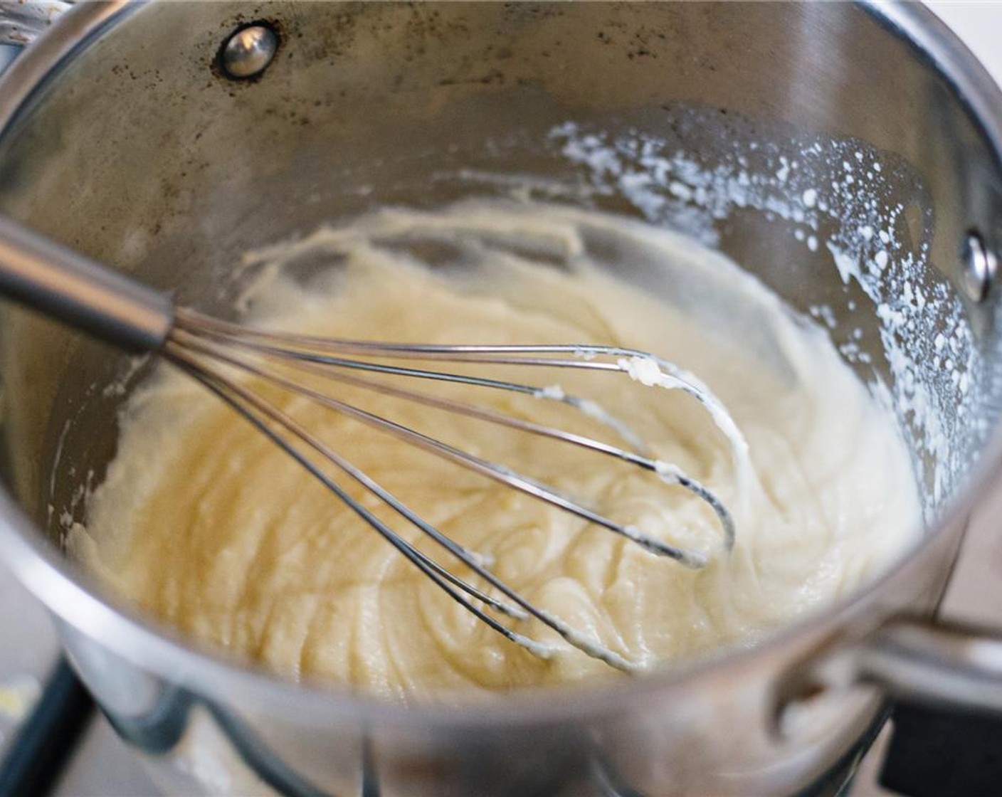 step 8 Continue to whisk and cook until the mixture thickens, about ten minutes.