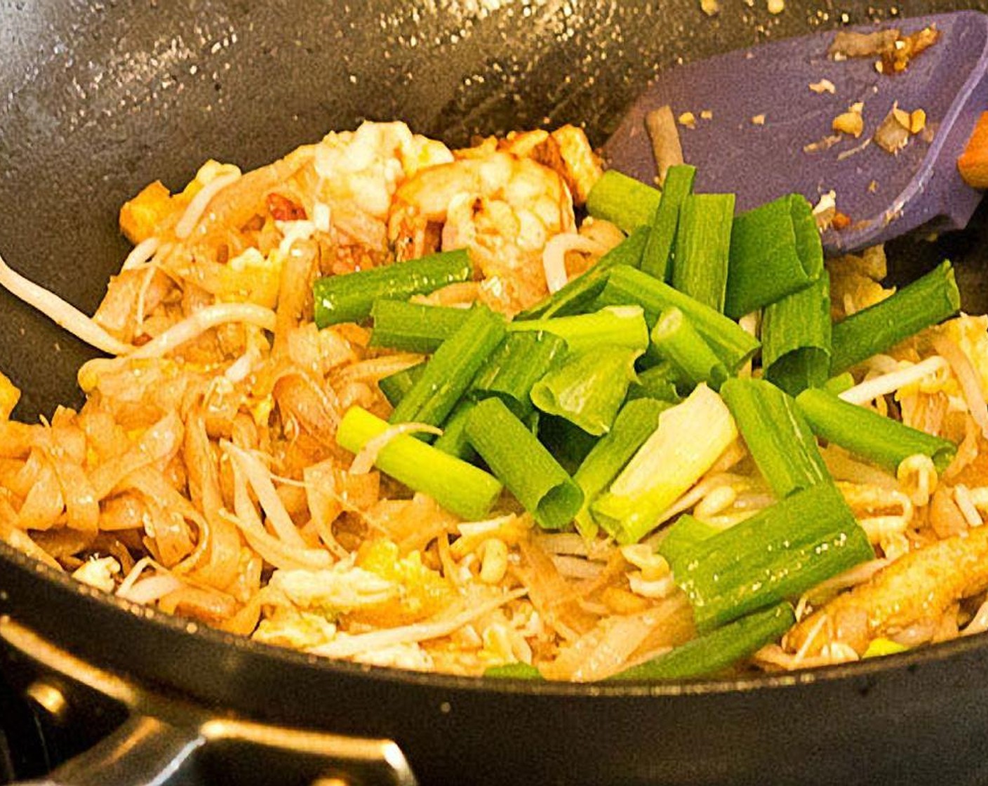 step 13 Stir everything for 1 minute, then add scallions. Turn off heat and toss.