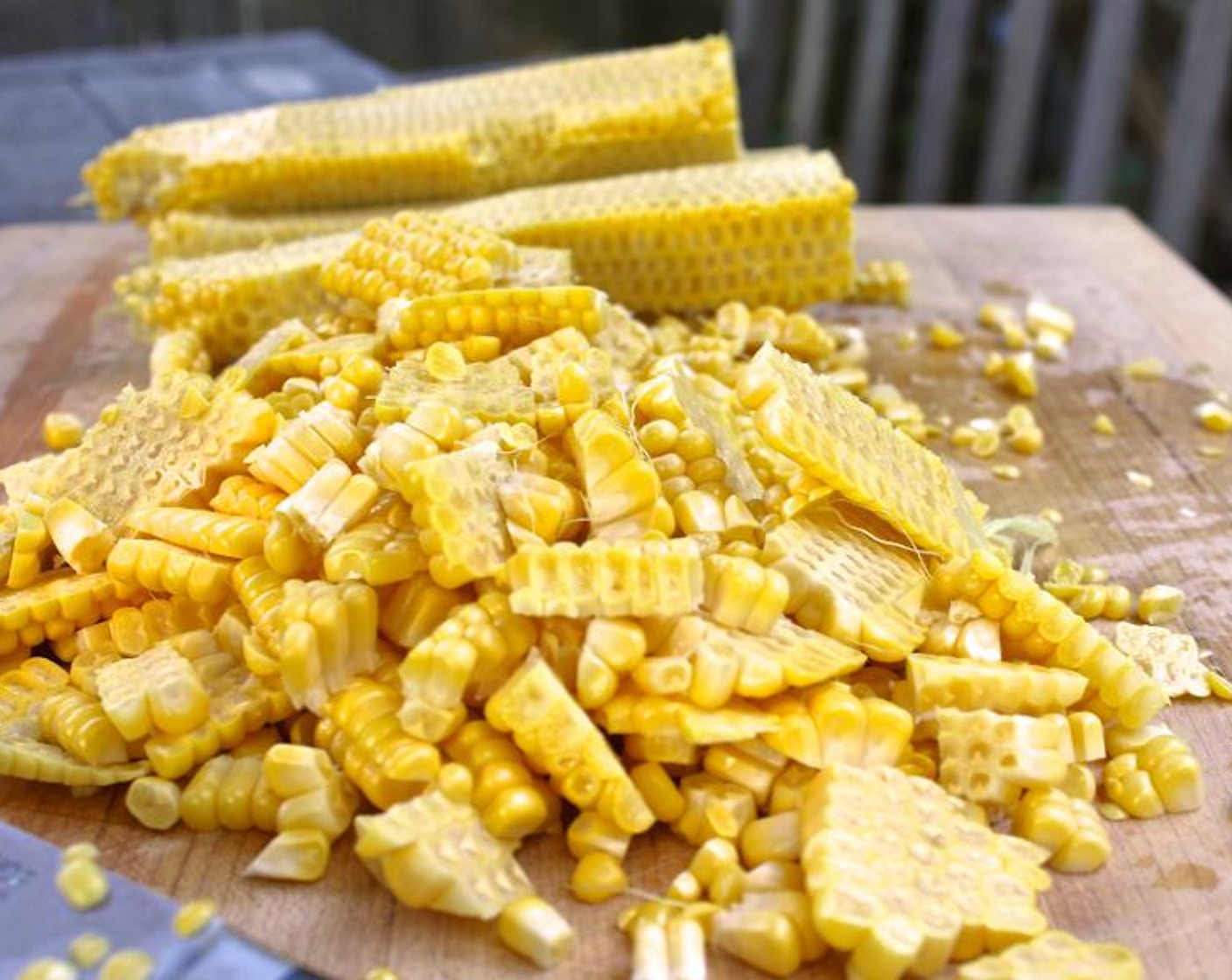 step 4 Spread the Cornbread (3 cups) and the kernels cut from Corn (4 ears) onto two separate sheet pans. Drizzle the corn with the Extra-Virgin Olive Oil (1 Tbsp) and toss to combine.