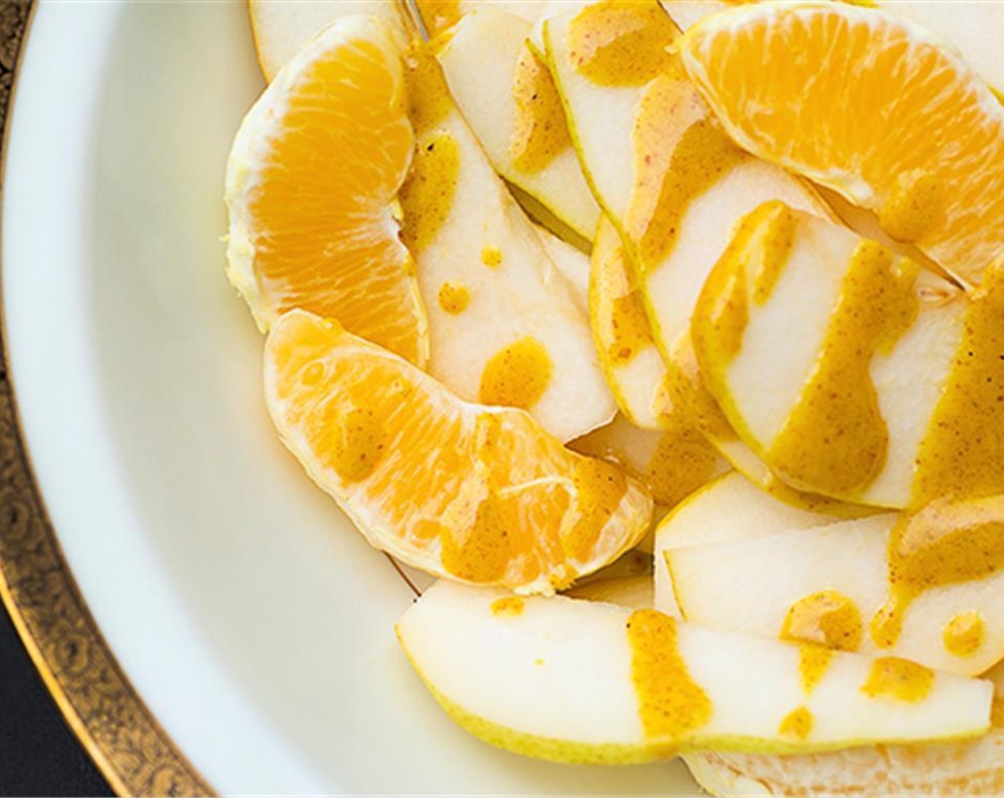 step 5 Place pears and oranges in bowl and drizzle 1 tbsp dressing over and toss to coat.