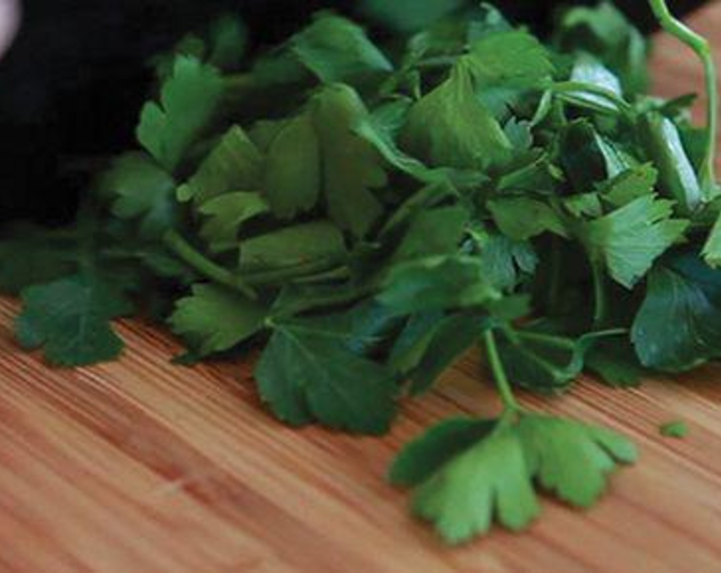 step 3 Chop the Italian Flat-Leaf Parsley (to taste) and Fresh Basil (to taste) and add it into the pot with halved Carrots (2) and halved Celery (2 stalks).