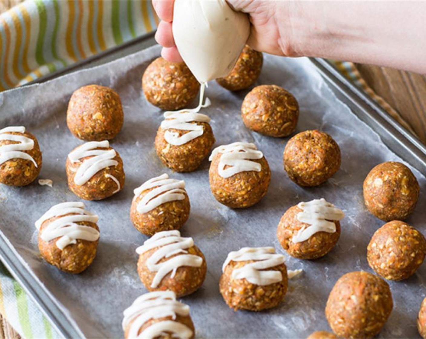 step 3 Transfer date mixture from food processor to bowl and stir in lightly pulsed Oats (3/4 cup). Stir to combine well. Line a pan with parchment paper. Roll mix into small balls (approx 28-30 depending on size) and place on lined pan.