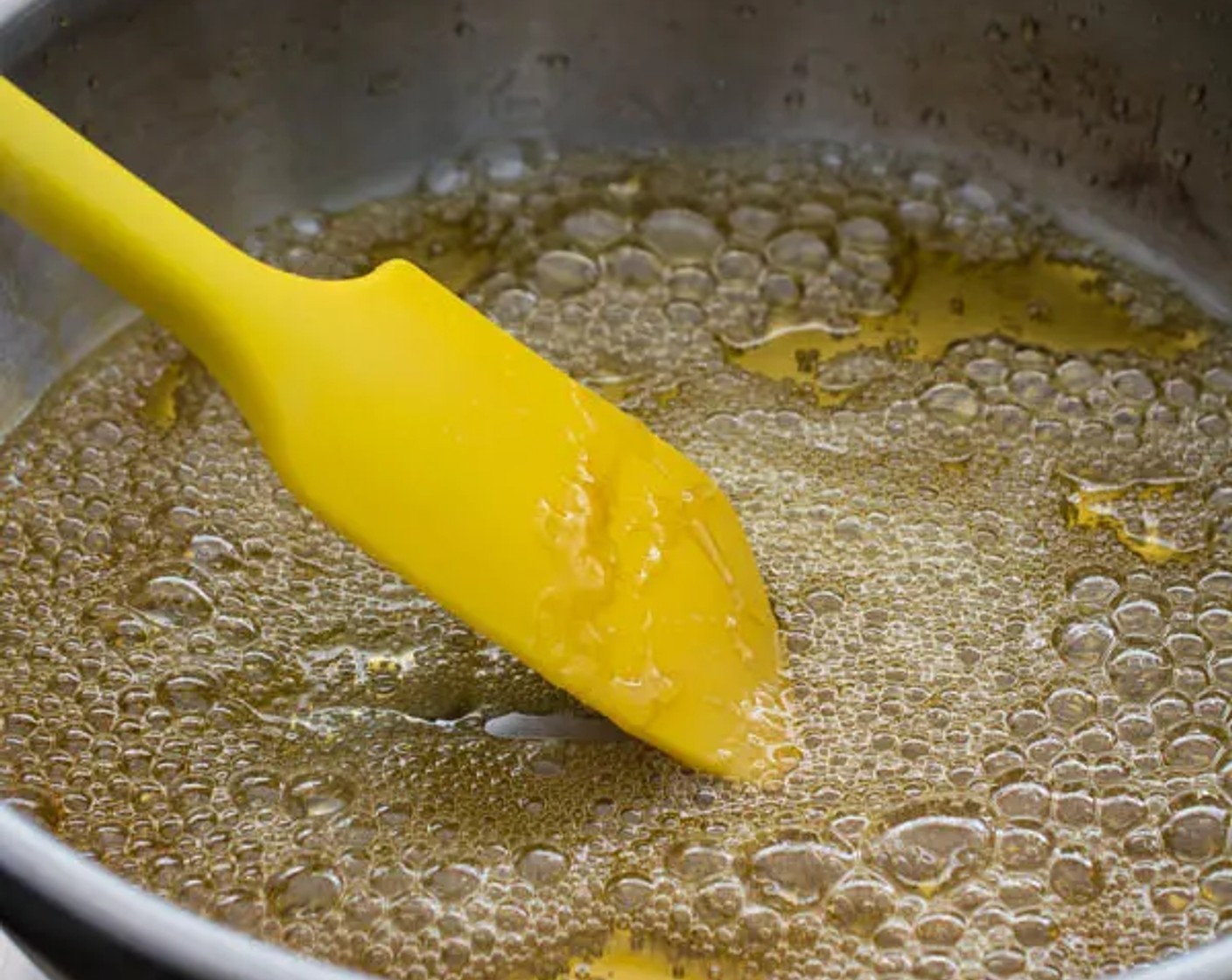 step 1 Prepare candied walnuts by combining Granulated Sugar (1/2 cup) and Water (1/2 cup) in a saucepan over medium heat. Stir frequently with a silicone spatula to prevent burning.