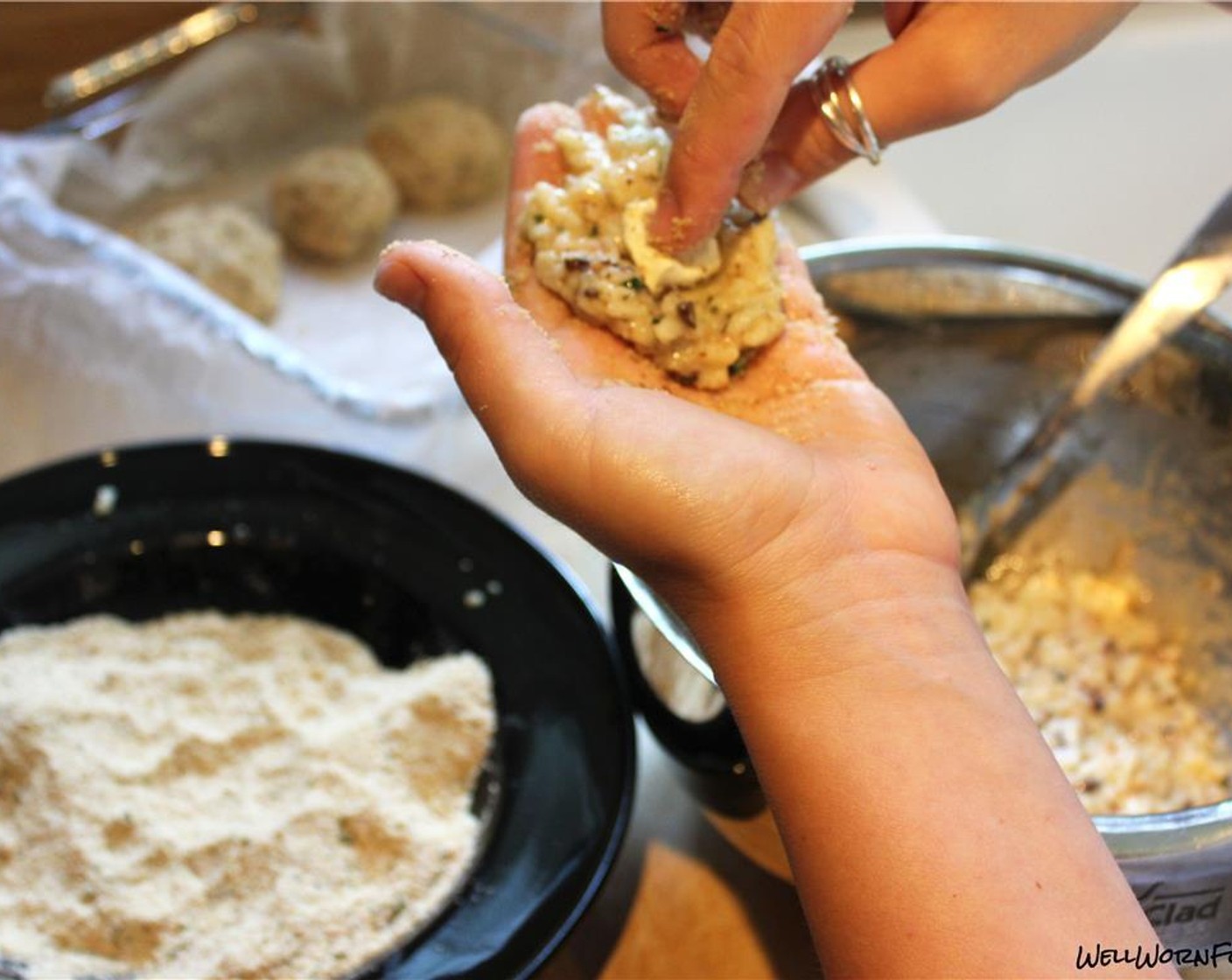 step 8 Scoop out a small amount of the risotto mixture and flatten with hands. Put the cream cheese in the center and then roll into a ball. Bread with breadcrumbs and set aside. This should make about 20 rice balls.