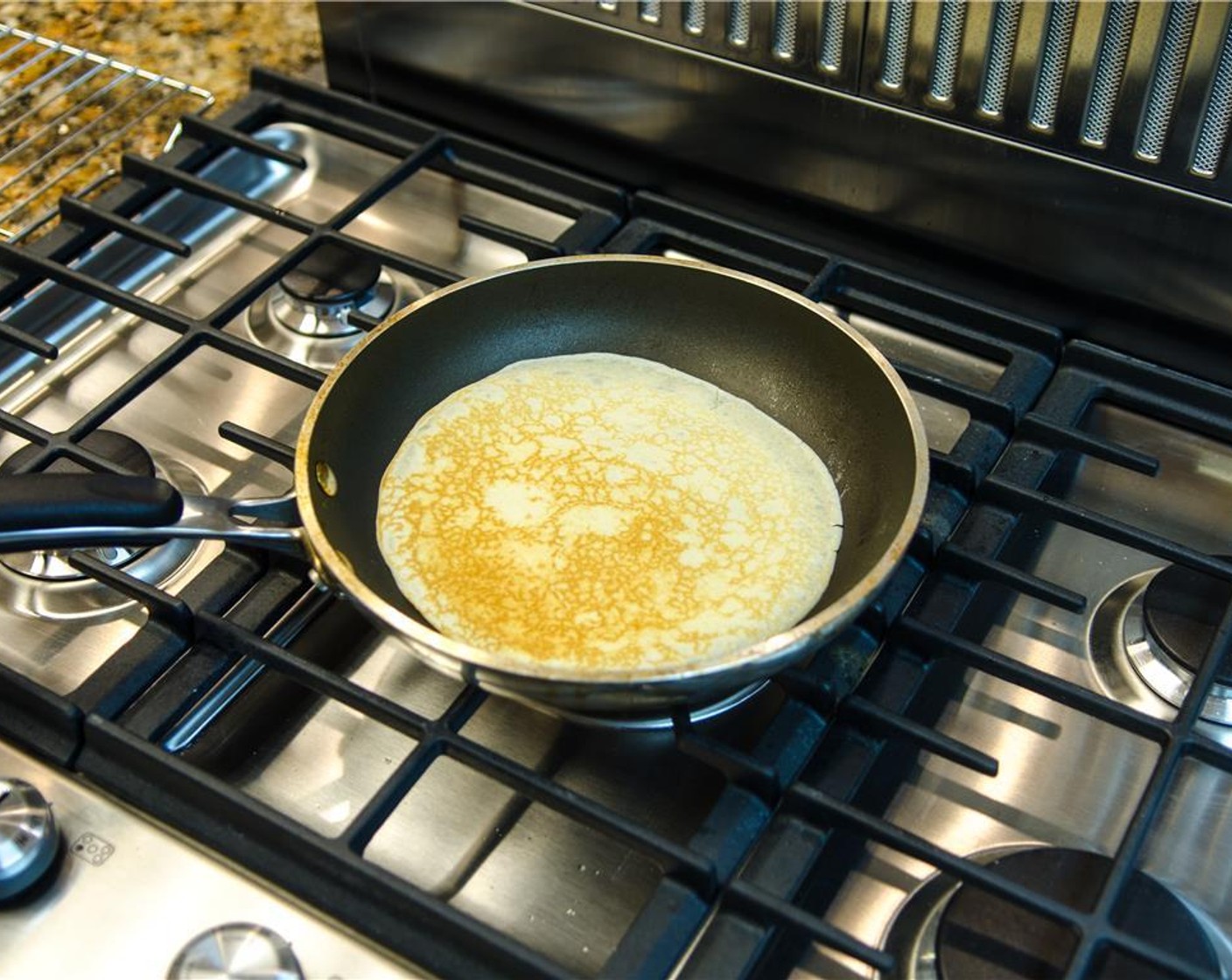 step 9 Turn the cooked crepe out onto a rack to cool while preparing the remaining crepes (repeat steps 2 – 4) or keep warm in a 200 degrees C (95 degrees C) oven.