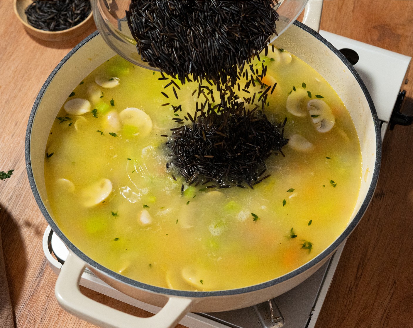 step 6 Add the Wild Rice (1 cup) and turn to medium-high and bring it to a boil. Once boiling, reduce the heat to simmer. Cover with a lid and cook for about 35 minutes.