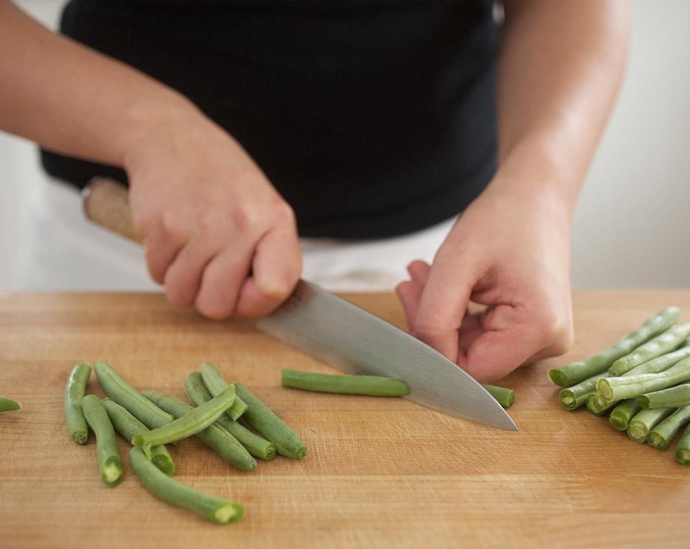 step 5 Trim the ends off of the Green Beans (2 bunches) and slice in half at a diagonal; set aside.