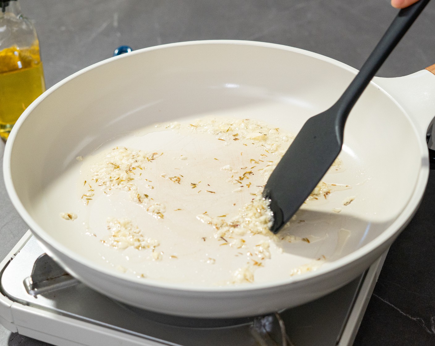 step 5 To make the garlic croutons, heat a skillet over medium heat. Add the Olive Oil (2 Tbsp), Garlic (2 cloves), and Dried Thyme (1/4 tsp), and sauté for 30 seconds or until the oil is hot.