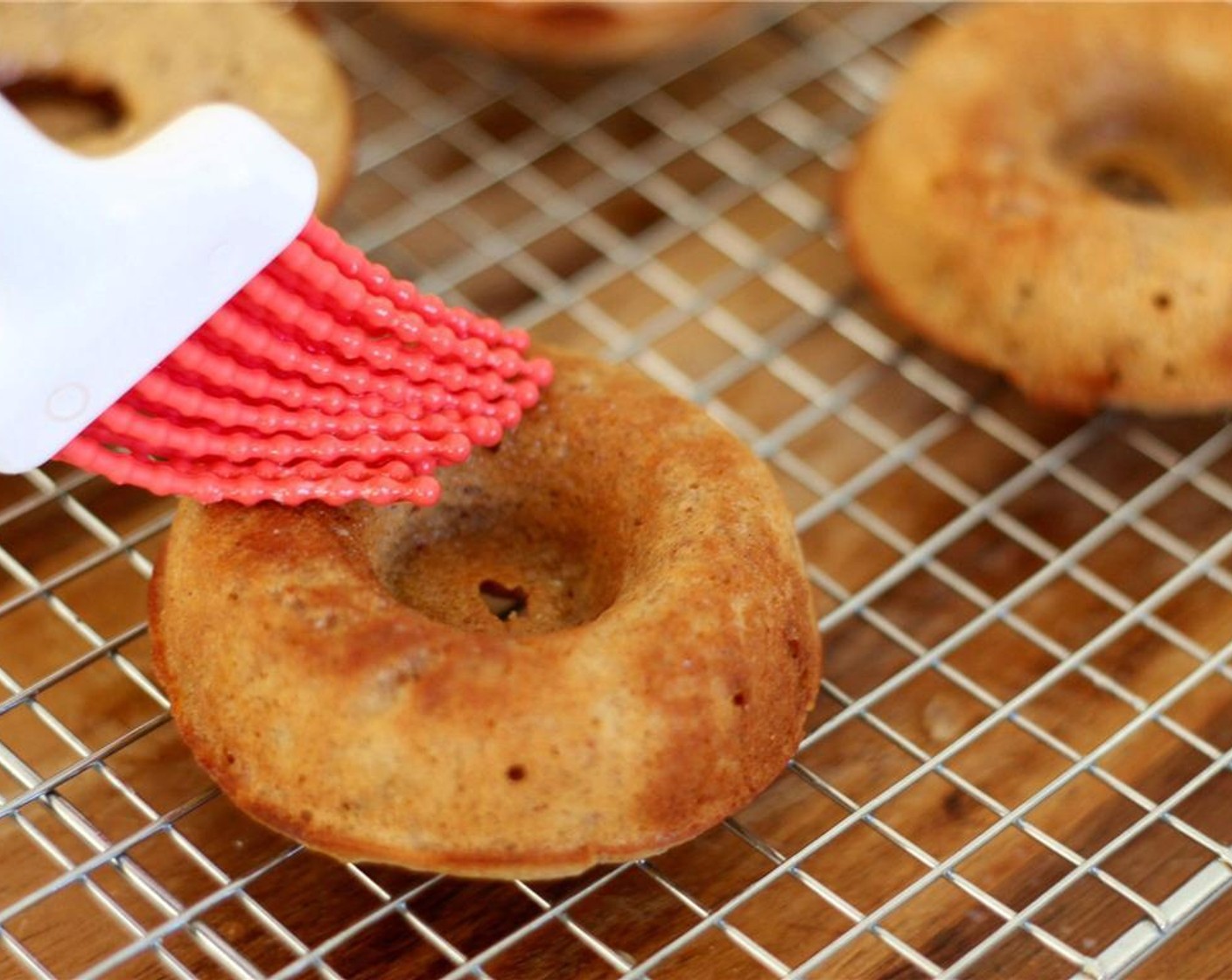 step 12 Brush the doughnuts on all sides with the butter.