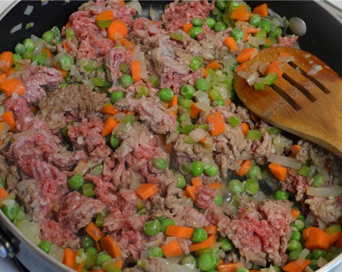 step 5 Add the Ground Beef (1 lb) and let it brown on medium-high heat along with all the veggies.