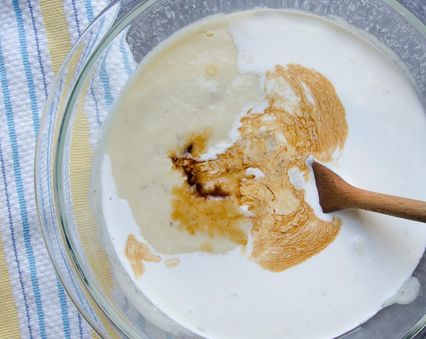 step 6 Stir the banana puree, Light Cream (1 cup) and Vanilla Extract (1 tsp) into the custard. Cover with plastic wrap and refrigerate until well chilled, 2 hours or overnight.