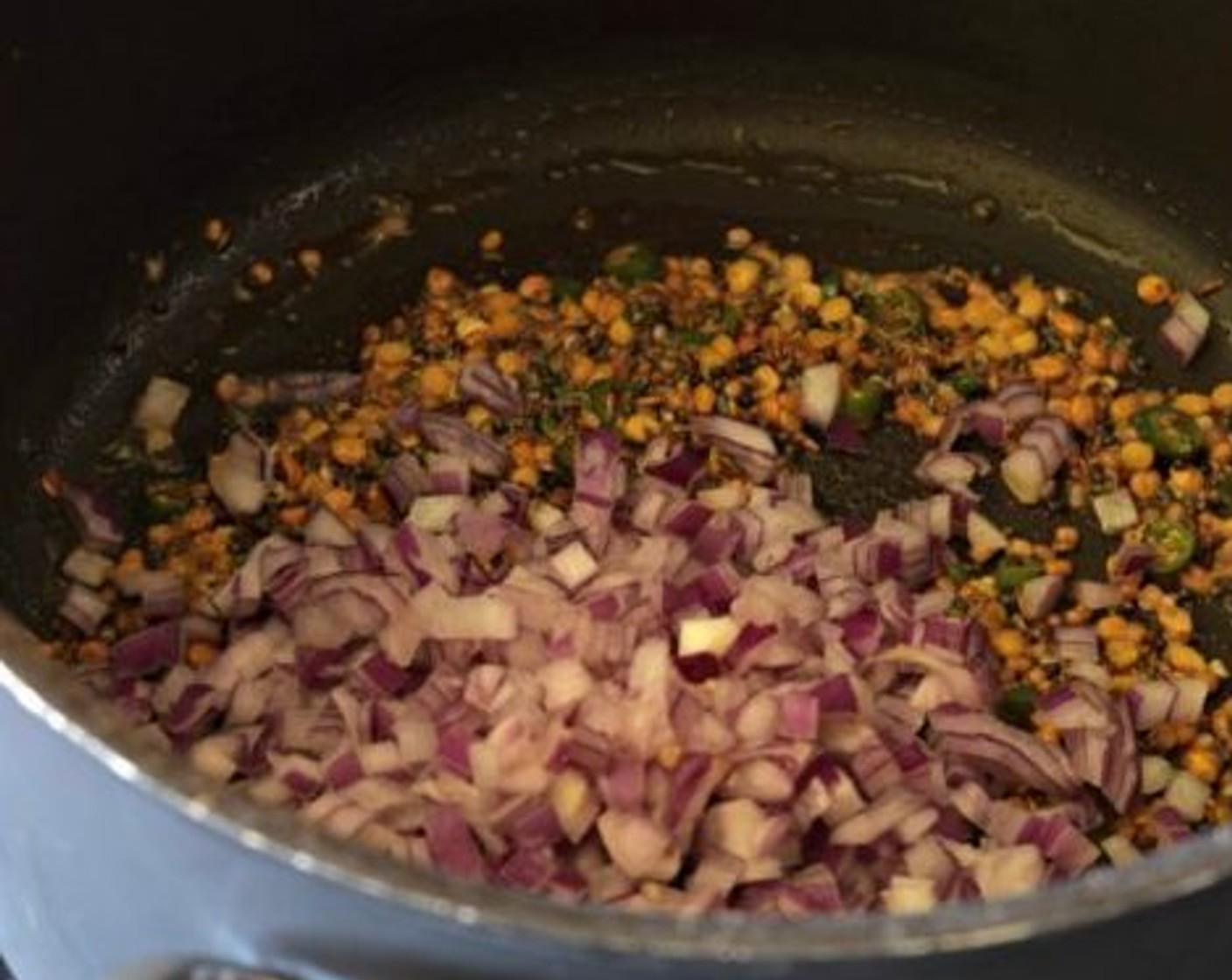 step 1 Heat Ghee (1 Tbsp) in a pan and temper Mustard Seeds (1 tsp) and Cumin Seeds (1 tsp). Once they crackle, add Chana Dal (1 Tbsp) and Black Lentils (1 Tbsp). Fry them till they turn golden.