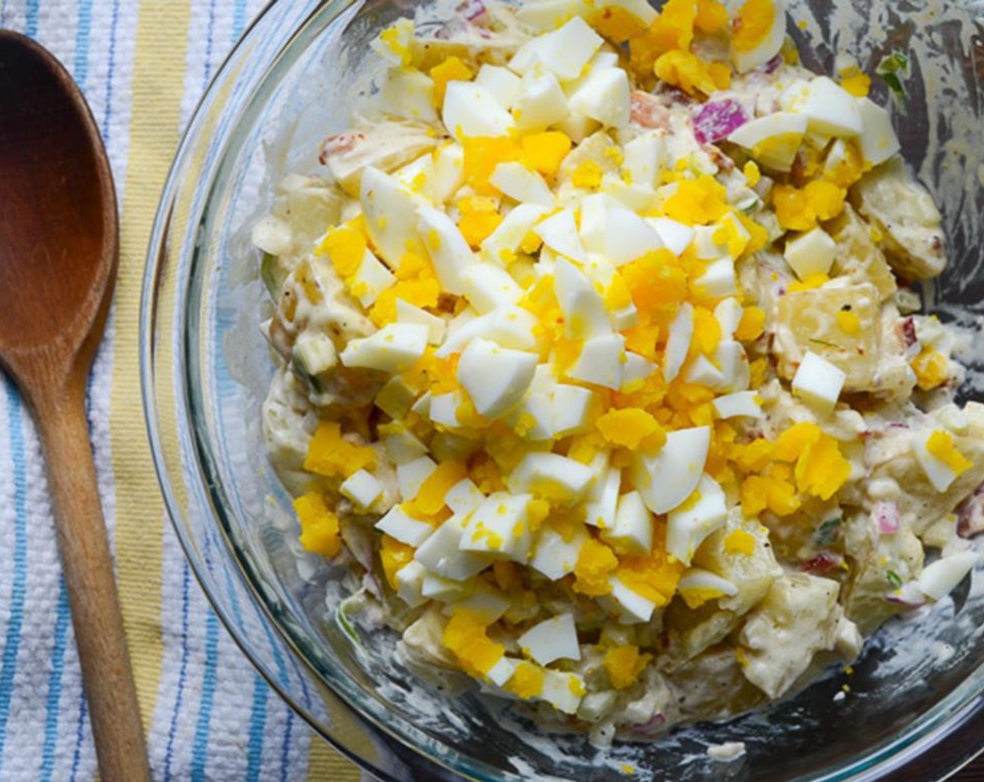 step 9 Peel and chop the hard-boiled eggs, and add them to the potatoes. Toss again gently.