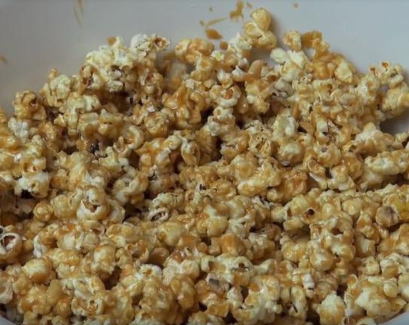step 4 Remove caramel from heat and add Dry Roasted Peanuts (1 cup). Pour over popcorn and toss gently until all of the popcorn is coated.