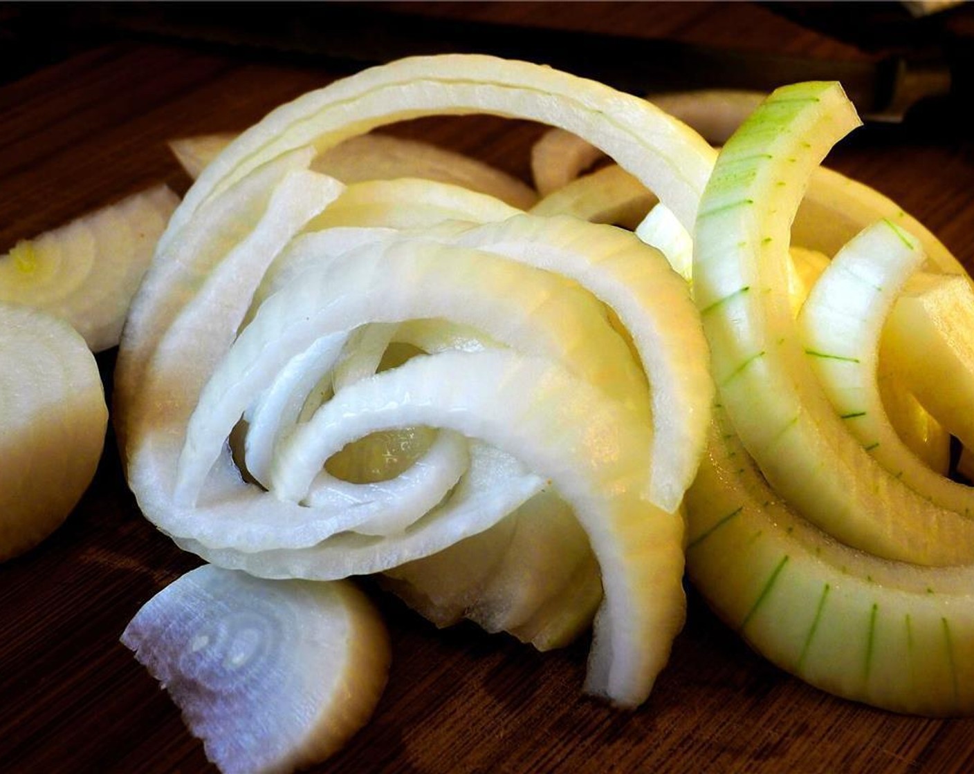 step 2 Slice the Onion (1) in half, and then chop into half-circles.