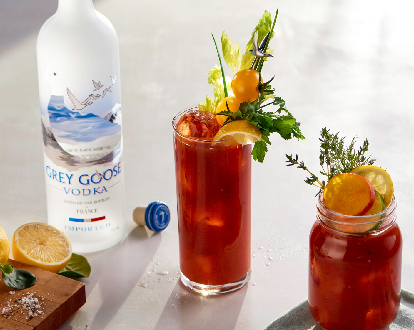 step 6 Strain into a highball glass and garnish with fresh cut Celery (4 ribs), Ground Black Pepper (to taste), and sprigs of aromatic Fresh Herbs (4 bunches).