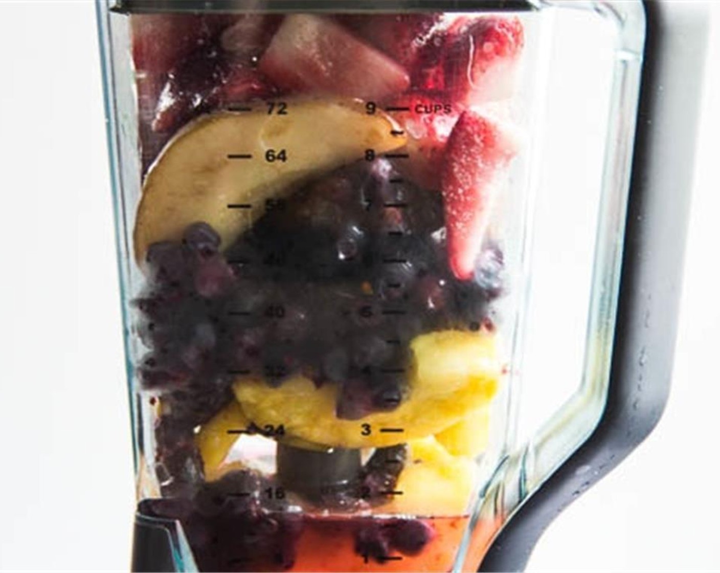 step 1 Combine the Frozen Pineapples (4 slices), Frozen Strawberries (2 cups), Pear (1), Frozen Blueberries (2 cups), and Water (2 cups) in a blender and blend until smooth.