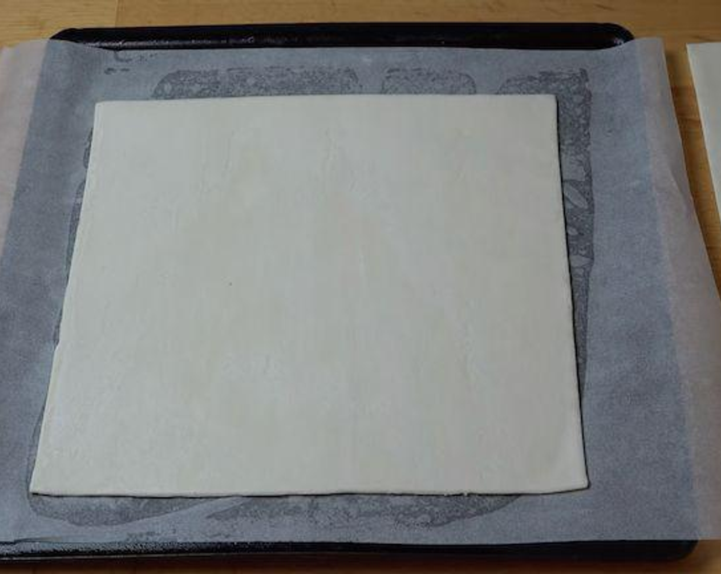 step 1 Lay out the Puff Pastry (2 sheets) on a large baking tray lined with non-stick baking paper.