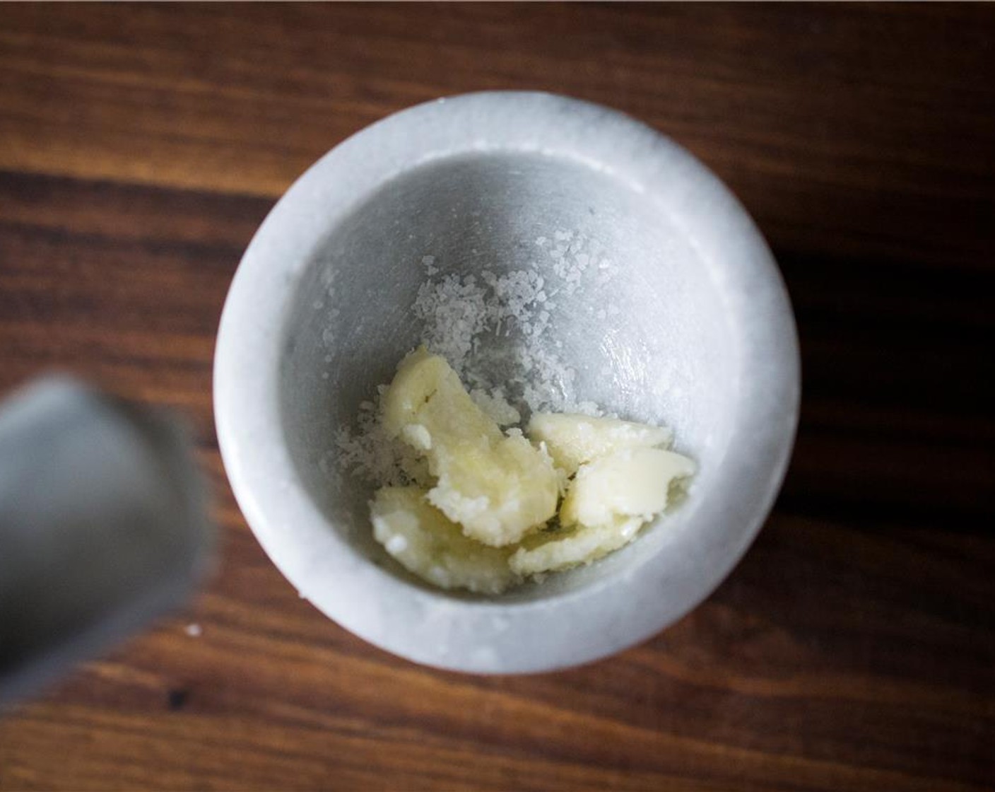 step 2 Mash the Garlic (2 cloves) and Kosher Salt (1 tsp) with a mortar and pestle.