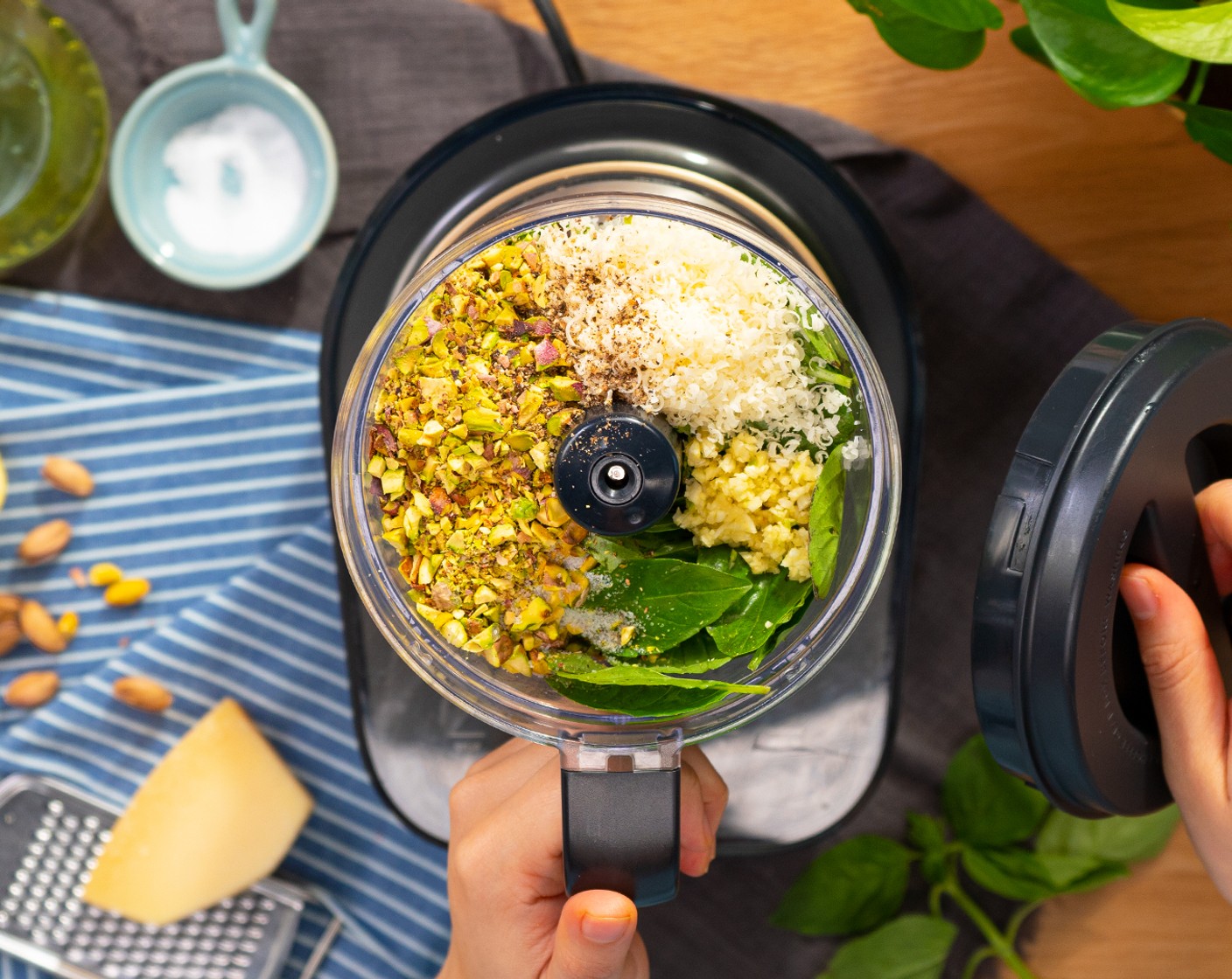 step 4 Pulse Fresh Basil Leaves (2 cups), Grated Parmesan Cheese (1/3 cup), Roasted Salted Pistachios (1/2 cup), Garlic (1 clove), Salt (1/2 tsp), and Ground Black Pepper (1/2 tsp) in a food processor until finely chopped.