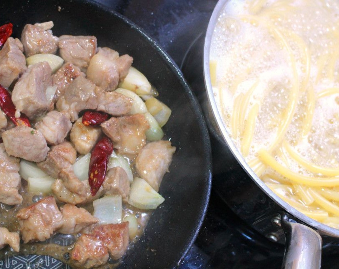 step 2 Heat the Peanut Oil (2 Tbsp), then sauté the pork, Dried Chili Peppers (to taste), and Onions (to taste) until the pork is halfway cooked.