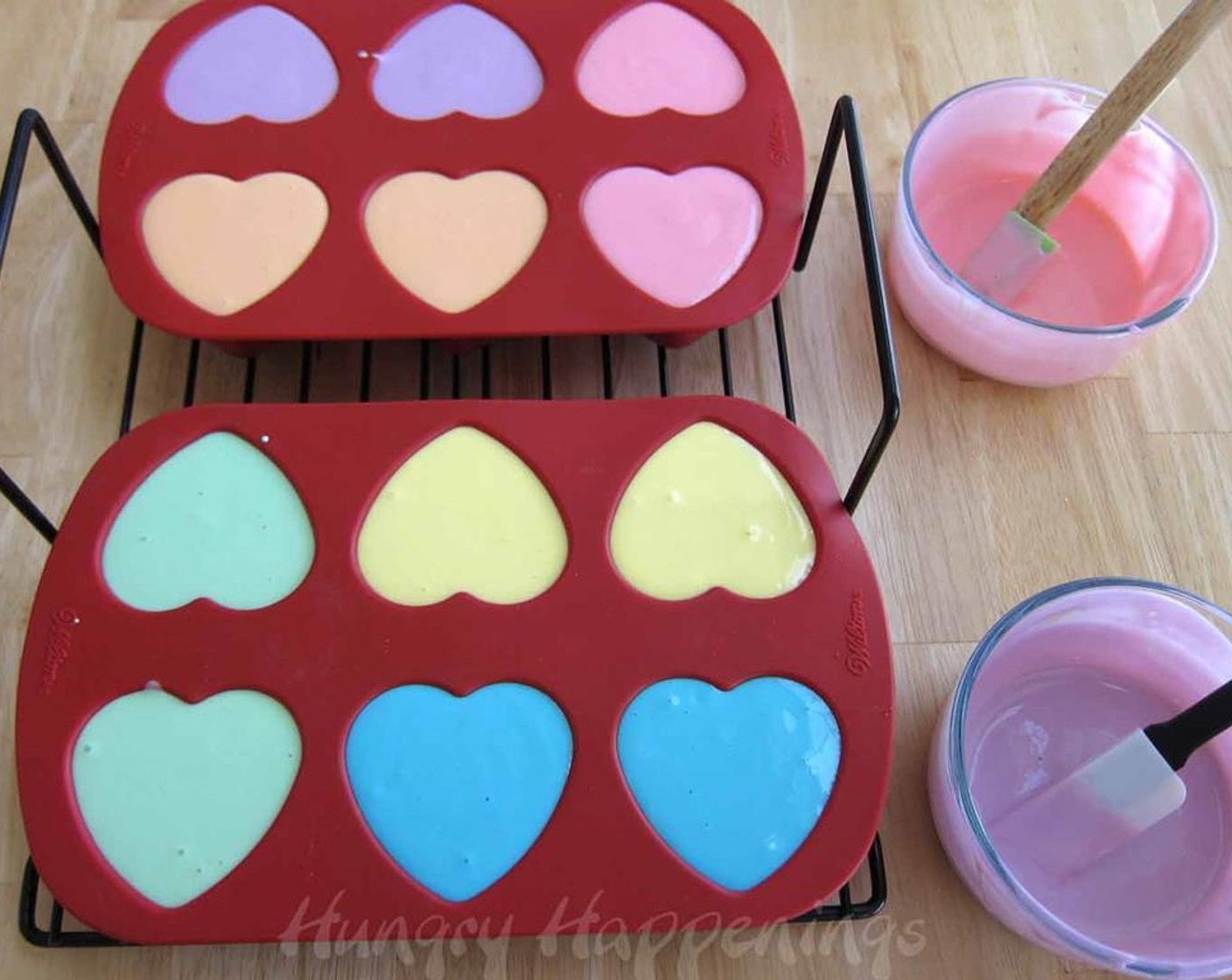 step 10 Pour colored cheesecake filling into the heart shaped cavities in your silicone mold.