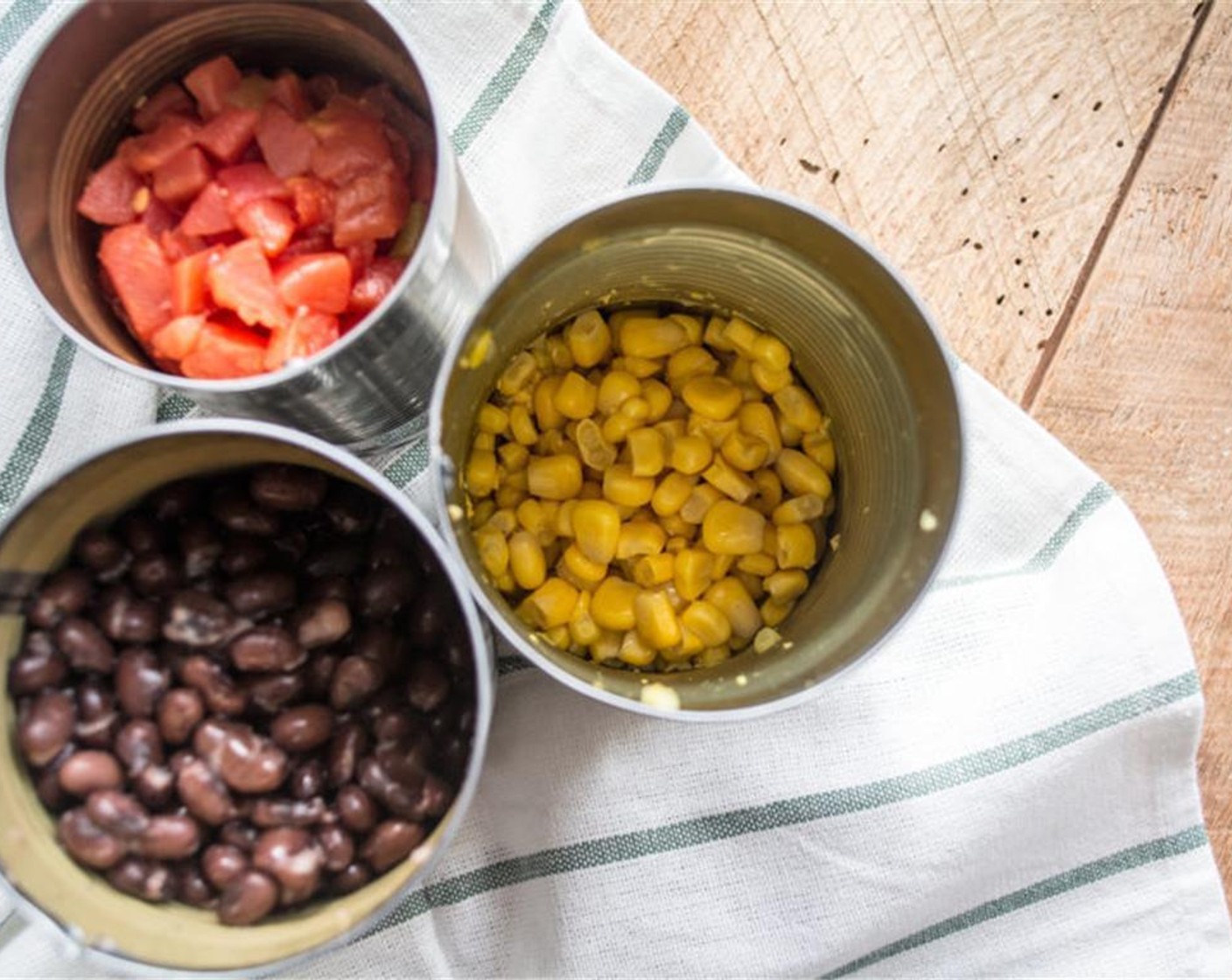 step 3 While the squash bakes, add rinse, drain and dry the Canned Corn (1 cup) and add to a dry skillet, sprinkle with the Chili Powder (1 Tbsp), Ground Cumin (1 tsp), and Simply Organic Garlic Powder (1/2 tsp), stir to combine, let the corn roast for several minutes before stirring.