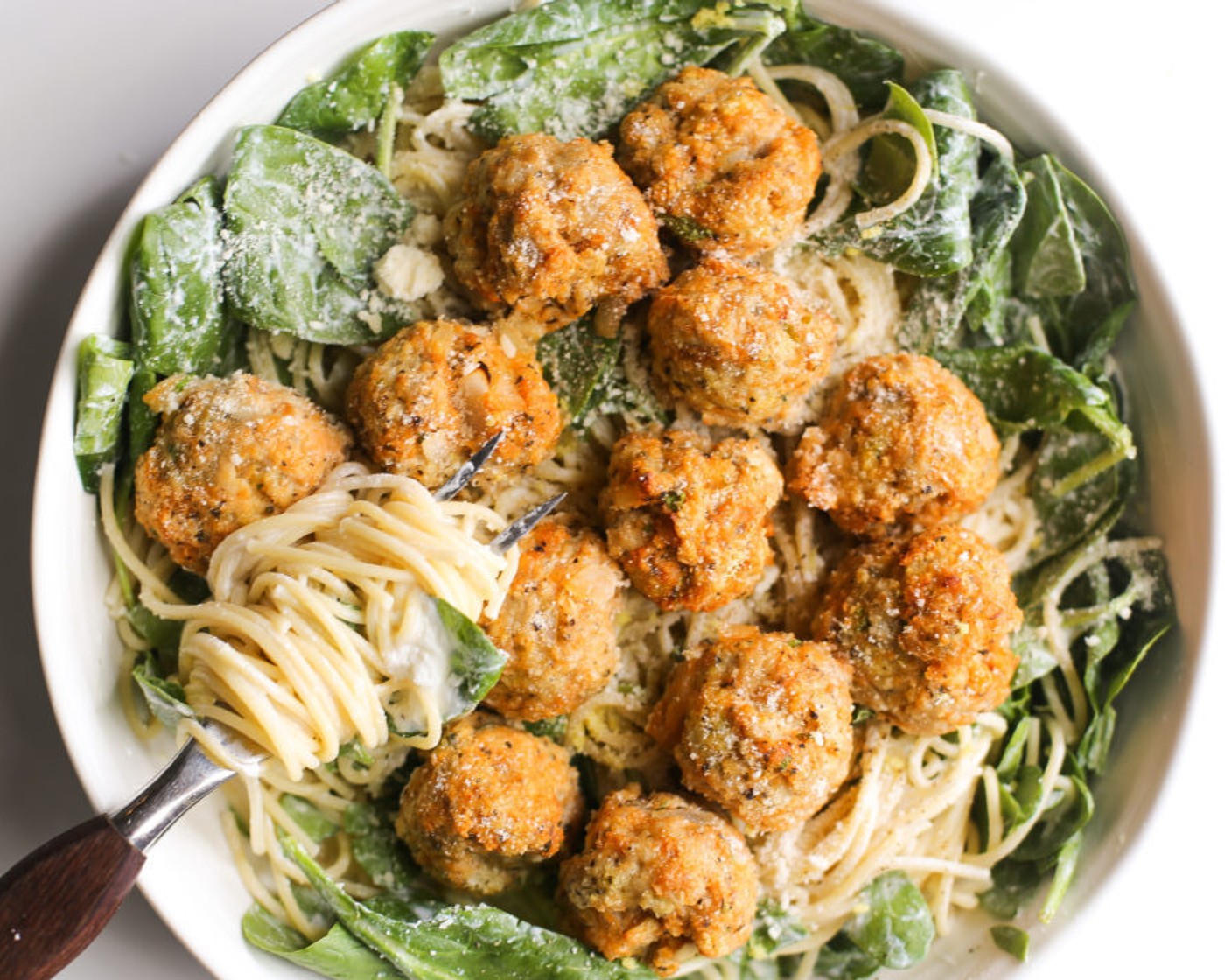 step 8 Plate the pasta with the meatballs, an extra dollop of ricotta if desired, Fresh Basil (to taste), Grated Parmesan Cheese (to taste), and a good grind of black pepper.