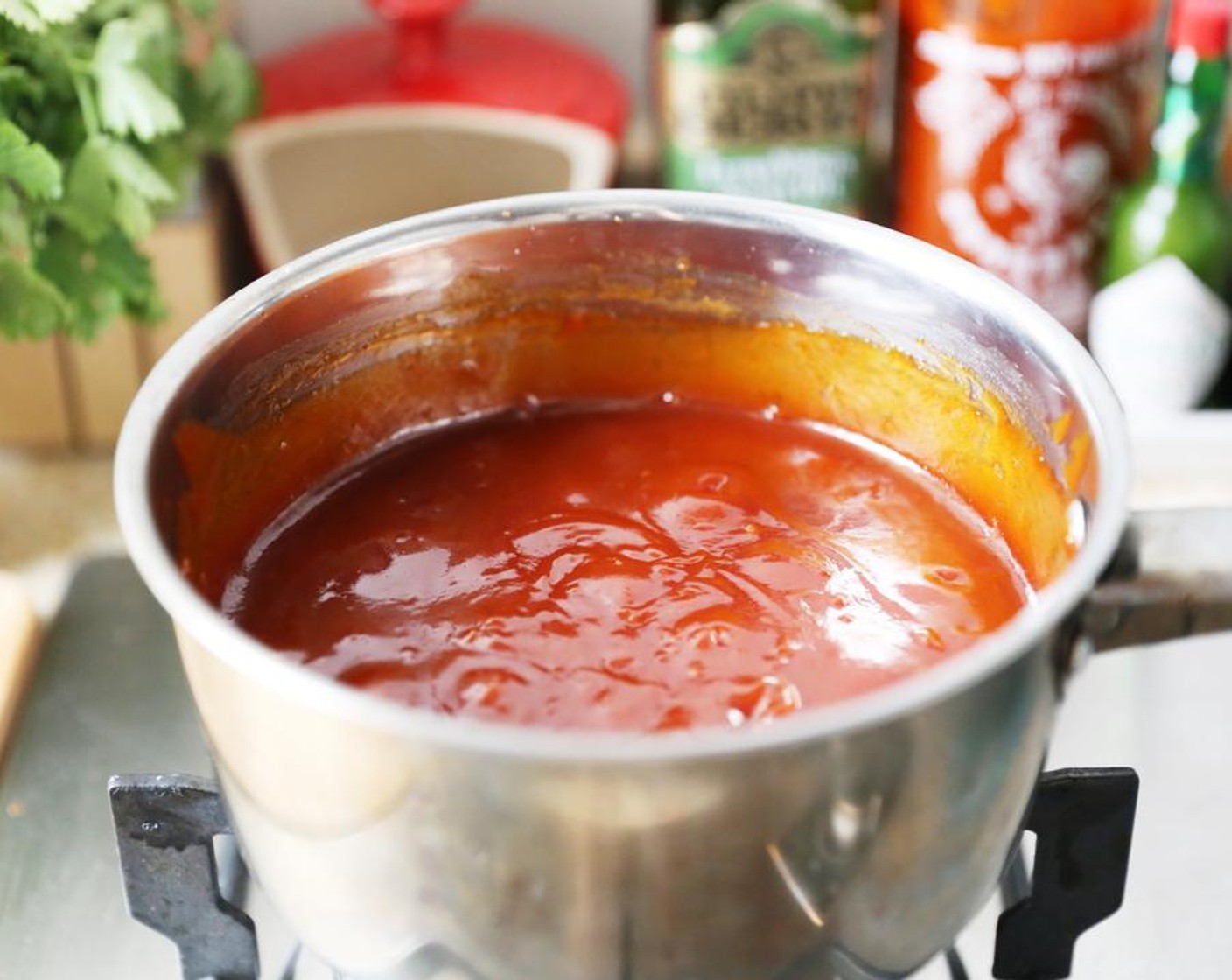 step 2 Bring to a boil while whisking allowing the cornstarch to thicken the mixture. Set aside. Thin with hot water if necessary.