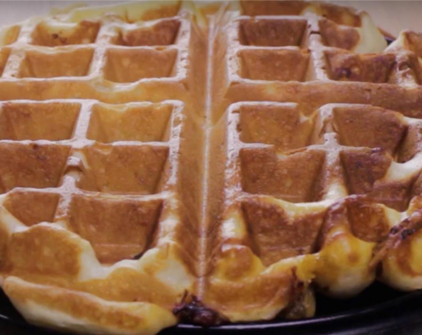 step 12 Open the waffle maker and check if it's golden brown in color with some darker cheese spots. Remove the pulled pork savory waffles carefully from the waffle maker and immediately flip it up in the air a few times. This will instantly develop a crisp outer layer.