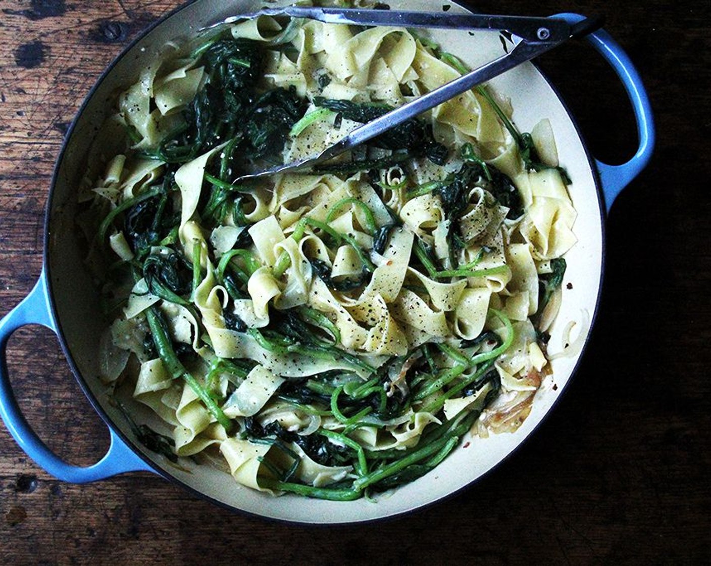 step 8 Pour egg mixture into pan and toss with tongs to combine, turning heat to low or medium if greens have cooled way down.