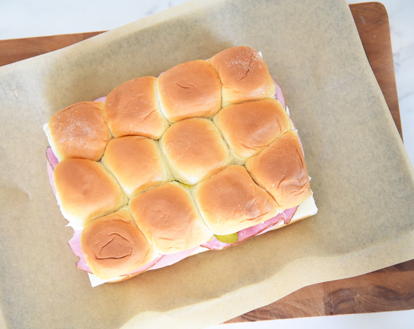 step 9 Place the tops of the rolls back on top of the sandwich.