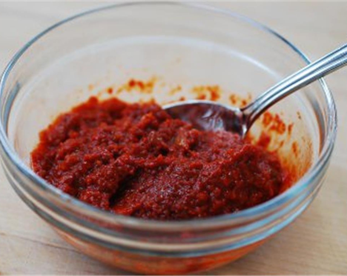 step 4 Mix Korean Chili Flakes (2 Tbsp), Soy Sauce (1 Tbsp) , Salt (1 tsp), Freshly Ground Black Pepper (1/8 tsp), Gochujang (1 tsp), Doenjang (1 tsp), Garlic (1 Tbsp), and Fresh Ginger (1 tsp) with 2 to 3 tablespoons of the broth or water.