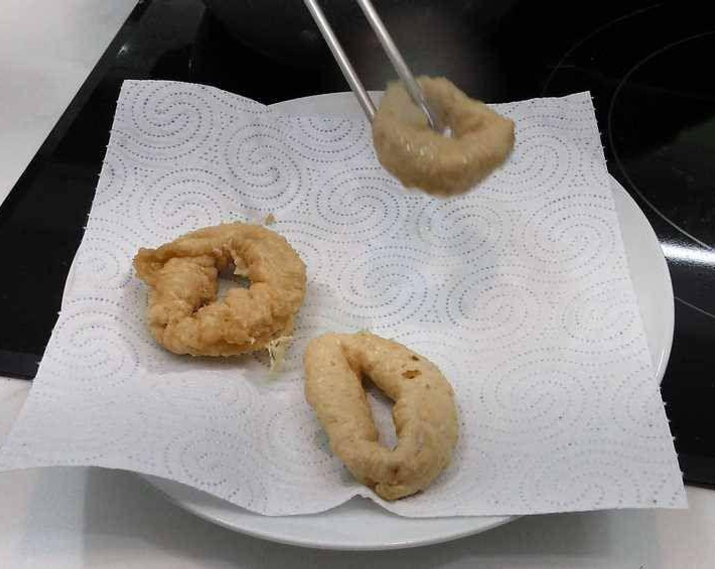 step 6 Keep frying till golden brown in color. Remove and transfer to a plate with paper towel to drain excess oil.