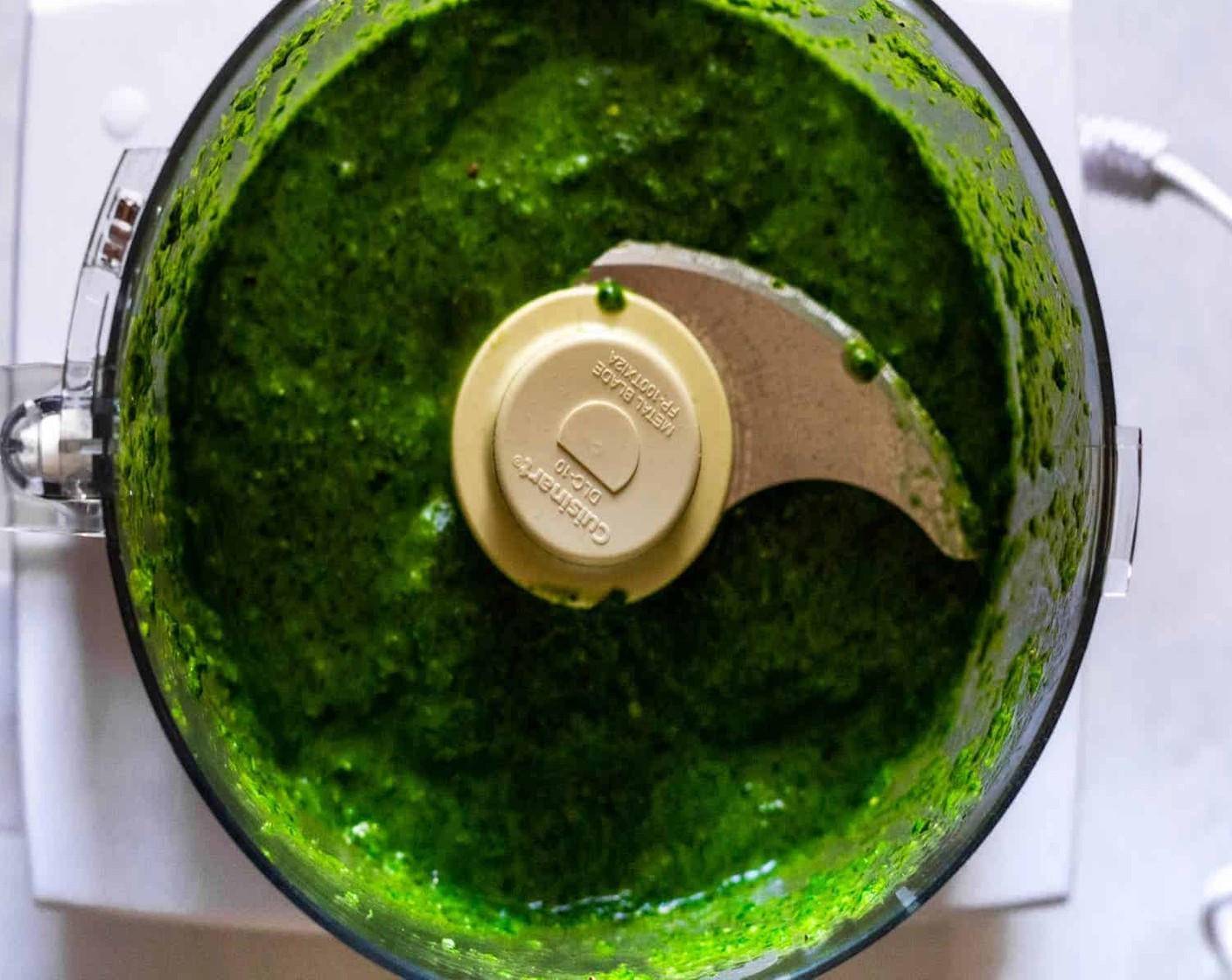 step 3 Meanwhile, make the pesto sauce by combining Fresh Basil (1 cup), Fresh Spinach (1 cup), Extra-Virgin Olive Oil (1/2 cup), Lemon (1/2), Garlic (2 cloves), Salt (to taste), and Ground Black Pepper (to taste) in a blender or food processor and pulse until the mixture is smooth.