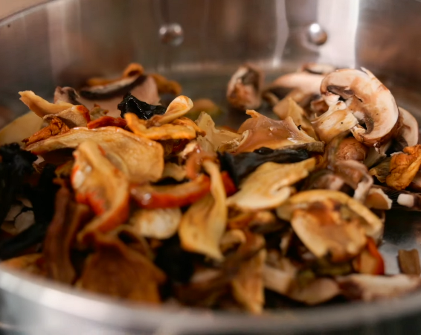 step 7 Next, add re-hydrated wild mushrooms. If the pan starts getting dry, add more olive oil or a splash of water.