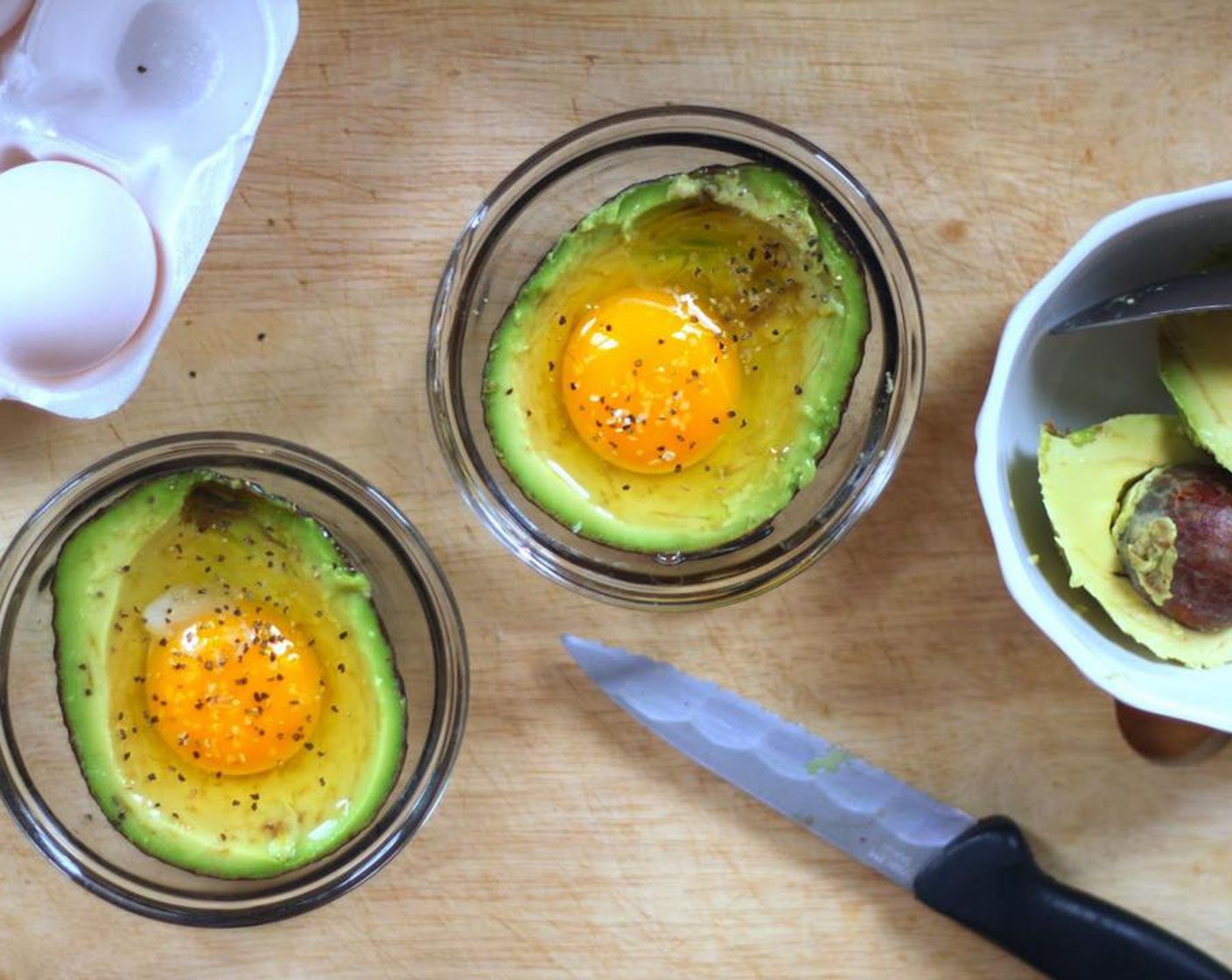 step 4 Sprinkle with a pinch of Salt (to taste) and Ground Black Pepper (to taste) then bake for 15 minutes, or 20 minutes if you don't want a runny yolk.