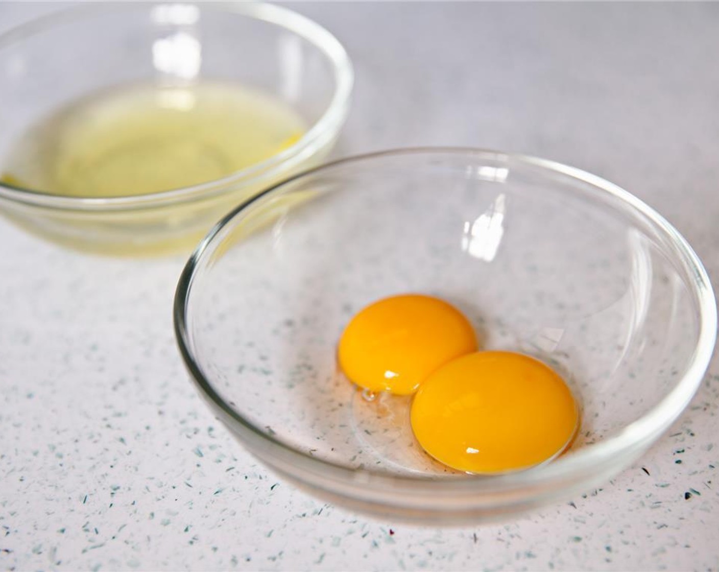 step 2 Place egg yolks in another bowl.
